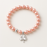 Bracelet perles d'eau douce roses argent 925 avec charm trèfle quatre feuilles porte-bonheur.