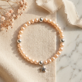 Bracelet perles d'eau douce roses argent 925 avec breloque étoile et billes argentées.