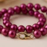 Bracelet perles d'eau douce rouge cerise avec fermoir mousqueton en argent 925.