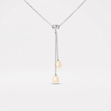 Collier toi et moi en argent 925 avec deux perles de culture roses suspendues en cascade.