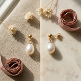 Boucles d'oreilles or blanc 9 carats avec perle de culture blanche ovale en pendant.