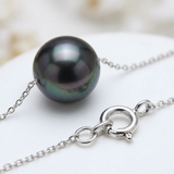 Bracelet argent 925 avec perle de culture noire de Tahiti, gros plan sur le fermoir à anneau.