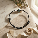 Bracelet homme en coton ciré noir avec perle de Tahiti 10/11mm et billes argent.