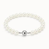 Bracelet perles blanches 6/7 mm en argent 925 avec fermoir boule argenté.