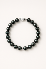 Bracelet perles d'eau douce noires façon Tahiti sur argent 925, fermoir ovale.