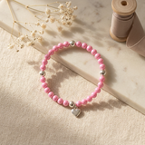 Bracelet perles d'eau douce roses fushia et argent 925 avec pendentif cœur.