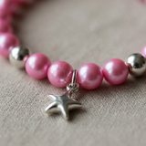 Bracelet perles d'eau douce roses fushia et argent 925 avec breloque étoile.