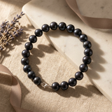 Bracelet en perles noires 8/9 mm sur argent 925 avec fermoir mousqueton.