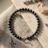 Bracelet perles noires 6/7 mm argent 925 avec fermoir réglable à chaînette.