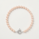 Bracelet en perles roses 6/7 mm sur argent 925 avec fermoir anneau marin argenté.